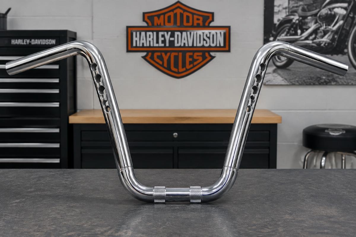 Ape hanger handlebars for harley-davidson showing chrome finish and drilled wiring holes