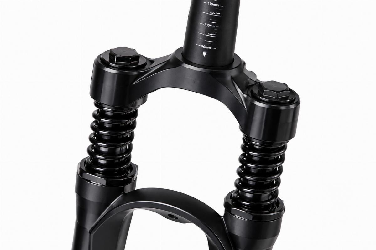 Black front spring fork shock assembly showing top tube painted markings