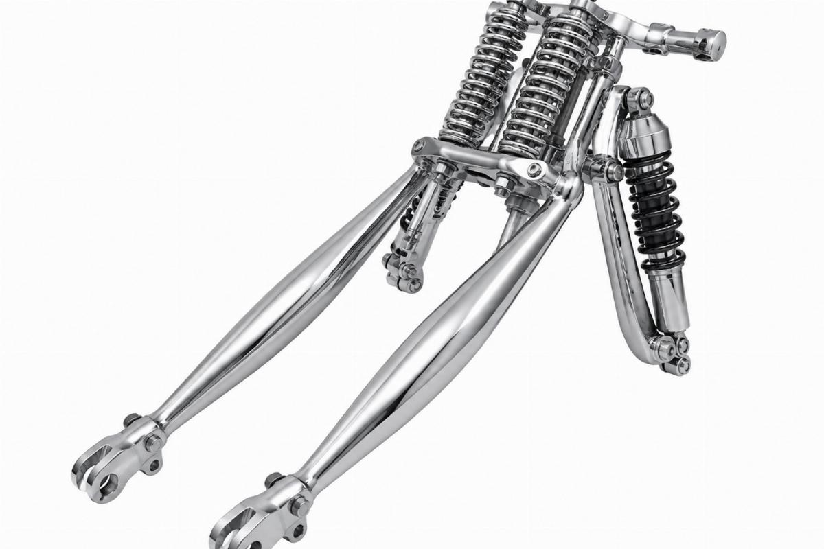 Chrome wide springer fork assembly for harley-davidson showing tapered oval rear legs and shocks