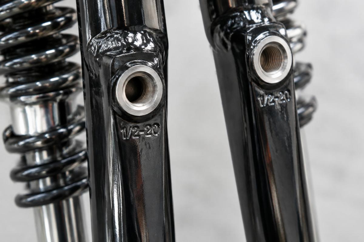 Close up of 1/2-20 drilled and tapped threads on narrow springer fork legs