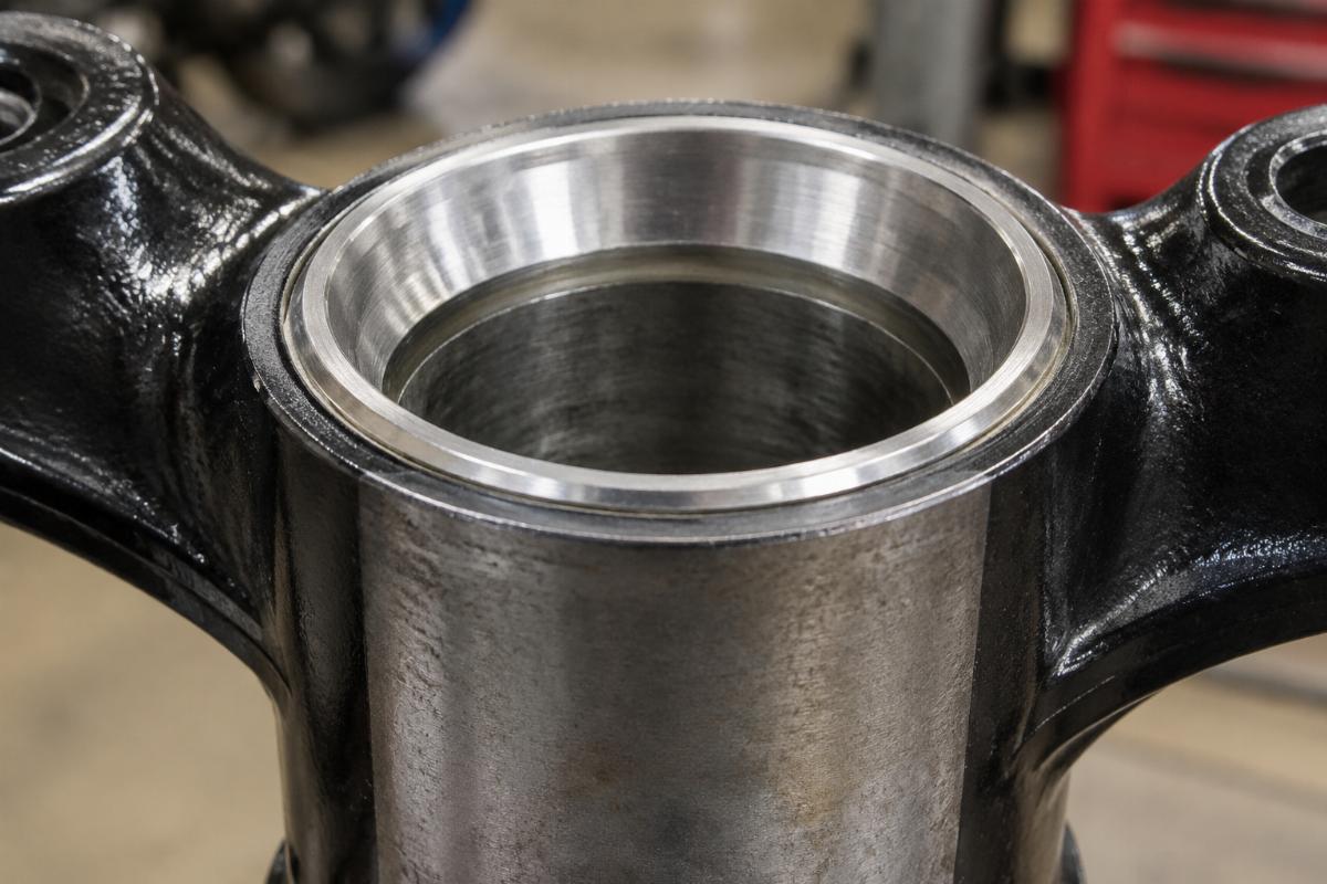 Close-up of a fork neck cup race for big twin showing the bearing seat surface