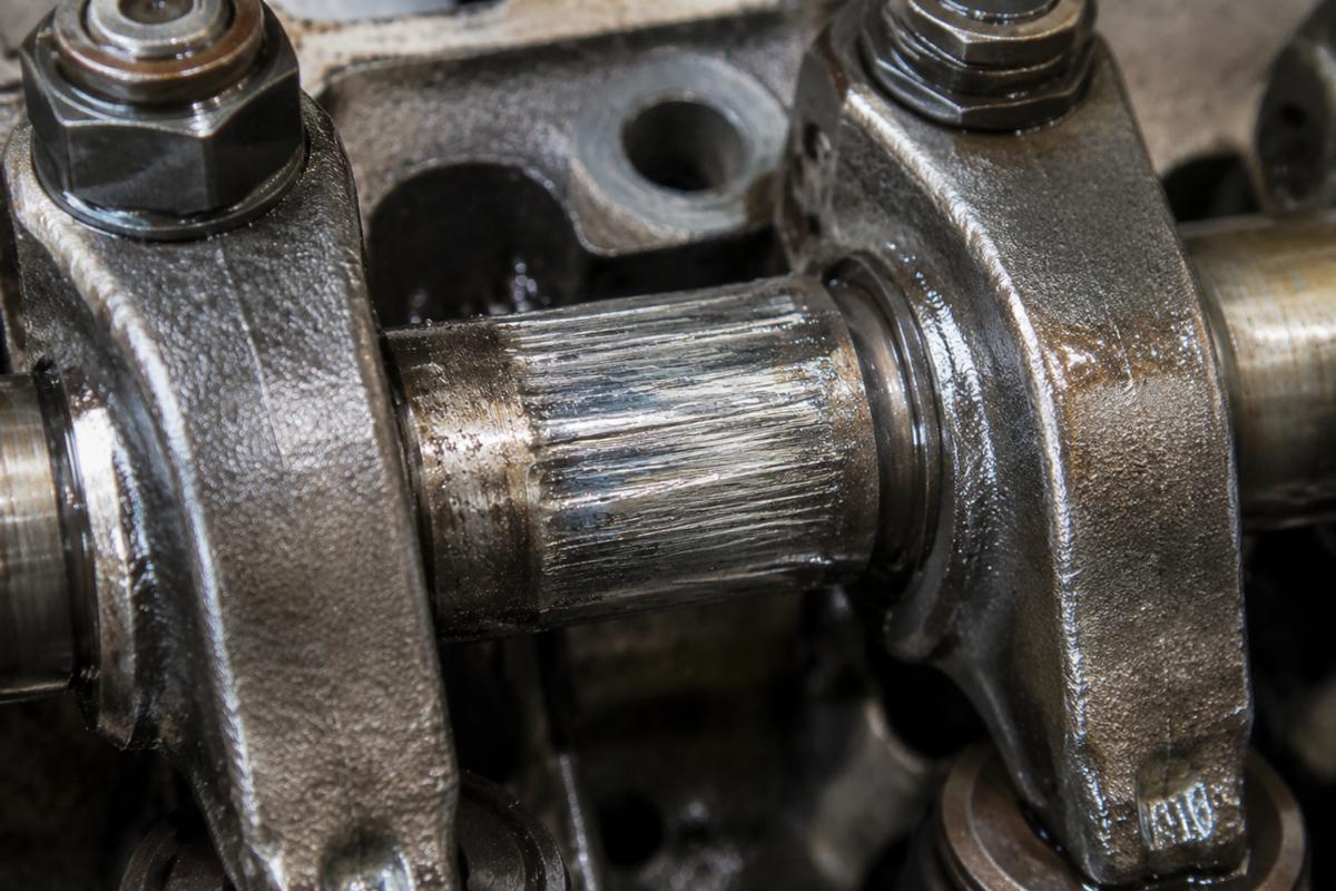 Close-up of a scored rocker shaft due to lack of oil clearance