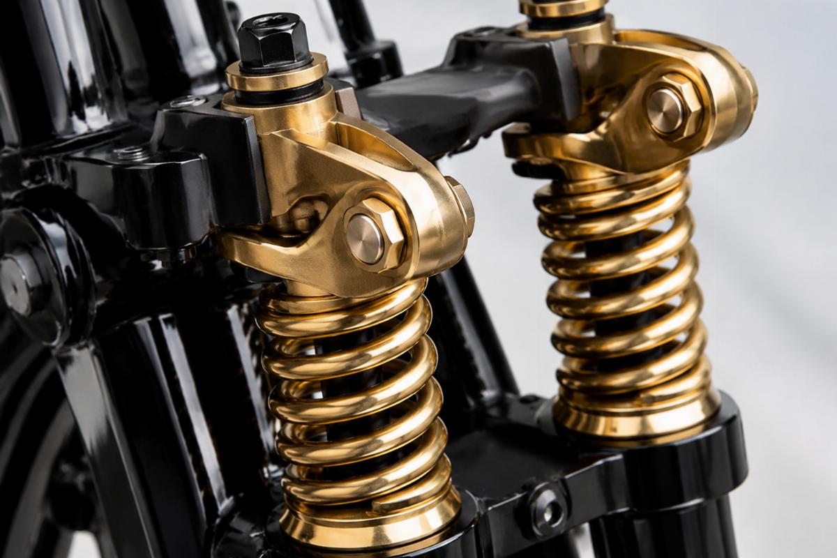 Close up of brass plated springs and rockers on the black 24 inch spring fork kit