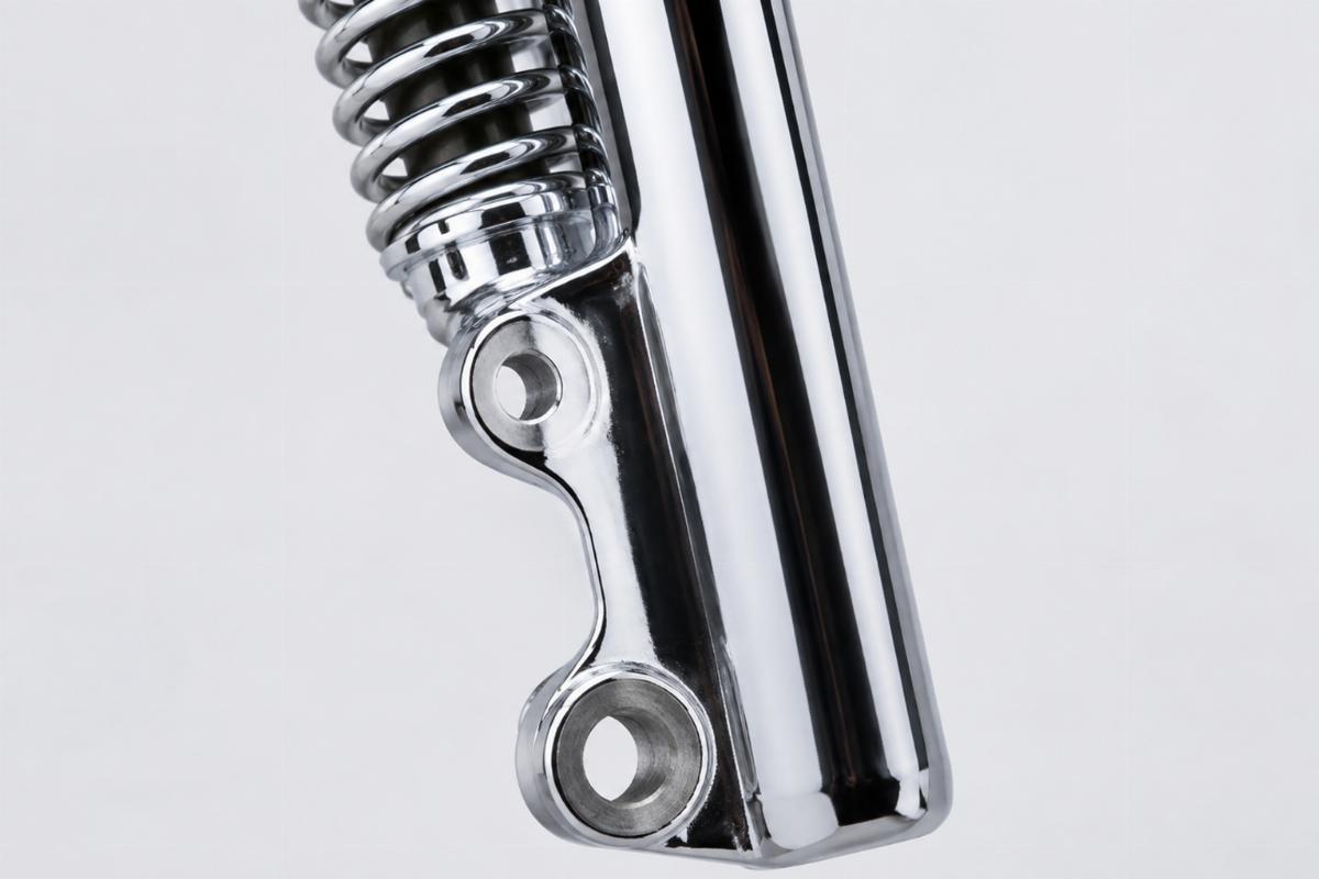 Close up of chrome finish and mounting holes on spring fork leg