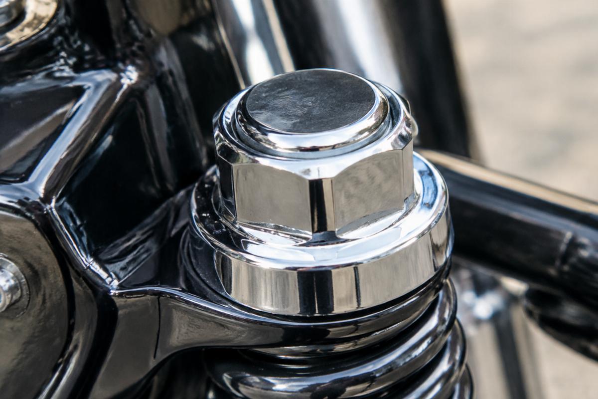 Close up of chrome finish on spring fork stem nut