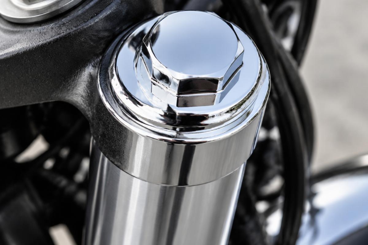 Close up of chrome plated finish on fork tube plug
