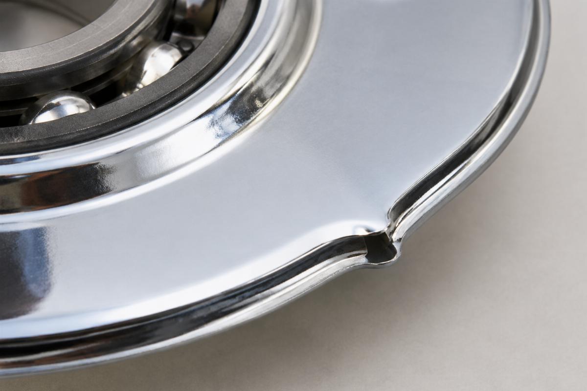 Close up of chrome plated lower bearing dust shield edge detail