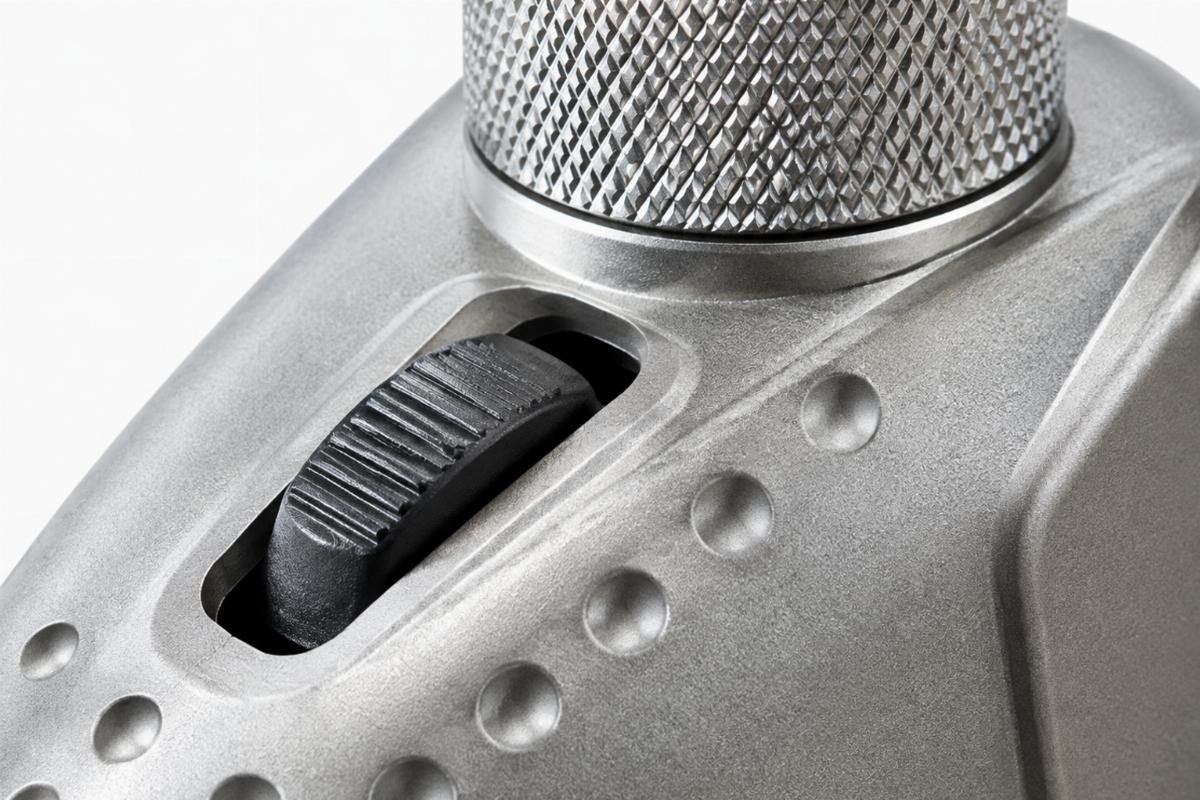 Close up of dimpled and slotted switch housing area with knurled riser section