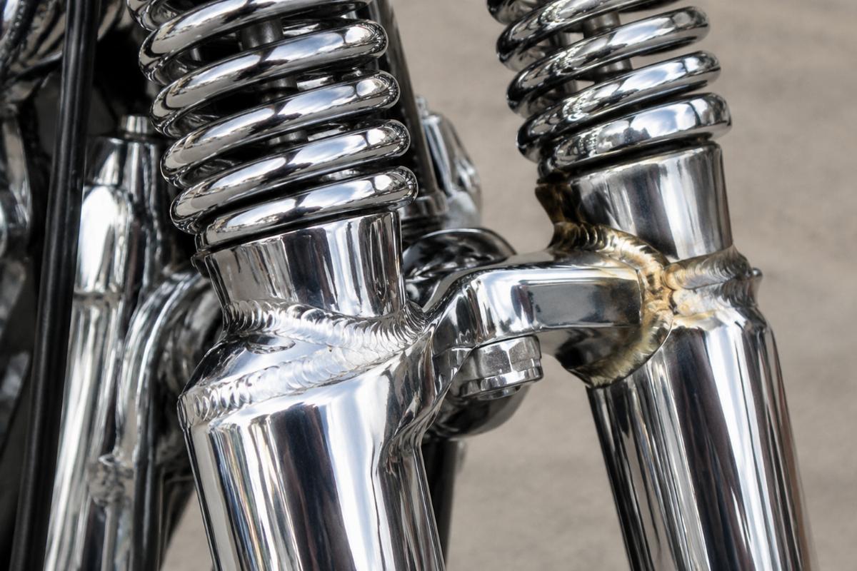 Close up of electric welded and brazed chrome springer fork joints