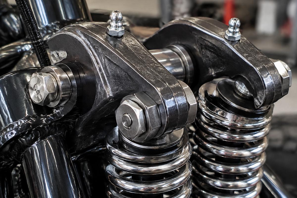 Close up of forged rockers and grease fittings on custom springer
