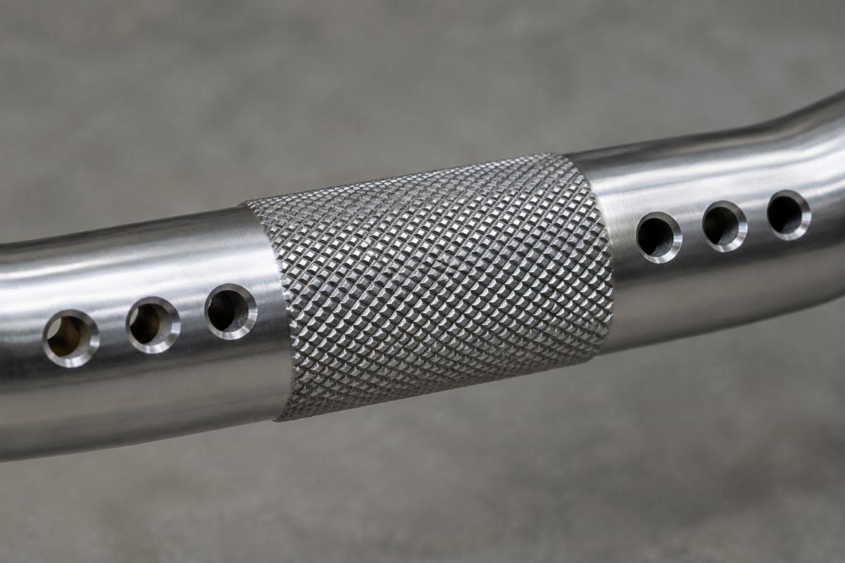 Close up of knurled center section and drilled holes on 1 inch handlebars