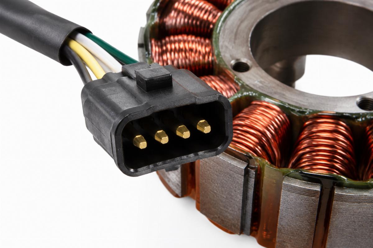 Close-up of the 4 pin male plug on the unmolded alternator stator for big twin