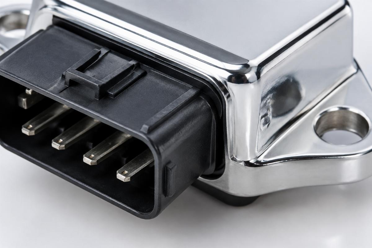 Close up of the chrome plated housing and connector pins on the electronic regulator