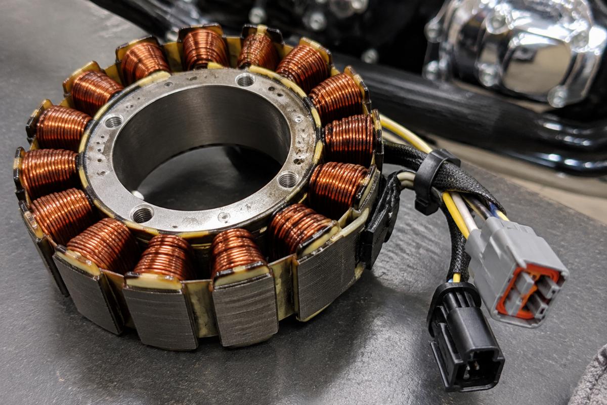 Close up of unmolded alternator stator for softail dyna showing wire connectors