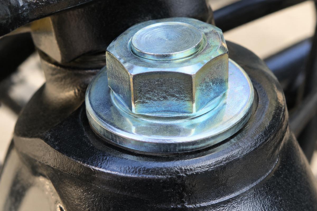 Close up of zinc plated finish on steering stem bolt and washer
