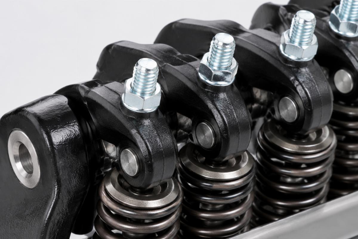 Close up of zinc plated rocker studs and black rockers on the inline spring fork assembly