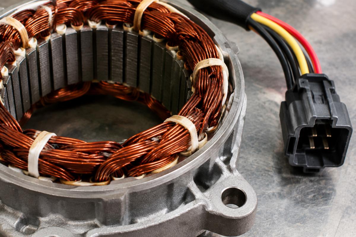 Close-up view of alternator stator for big twin and unmolded wiring connector