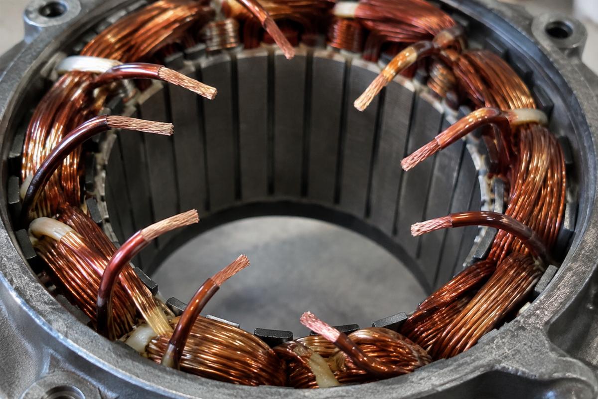 Close up view of an alternator stator for big twin showing unmolded wire ends