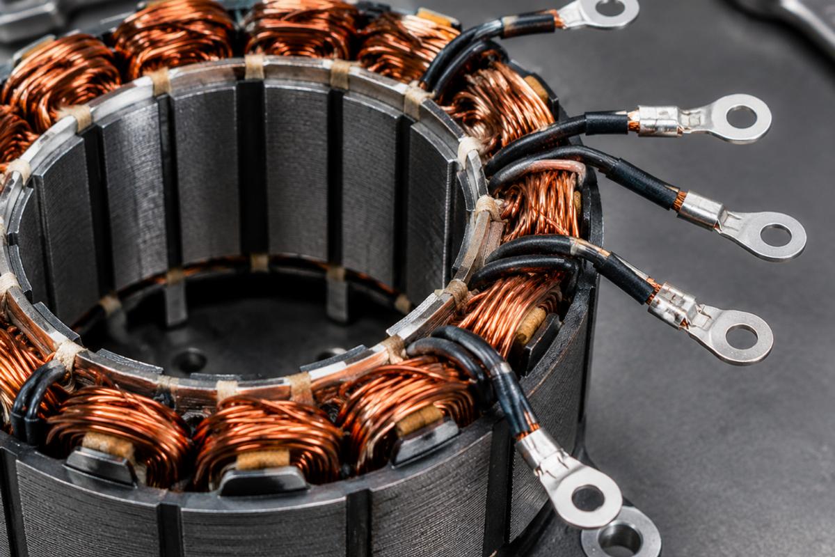 Close-up view of unmolded alternator stator for softail dyna showing wire terminals