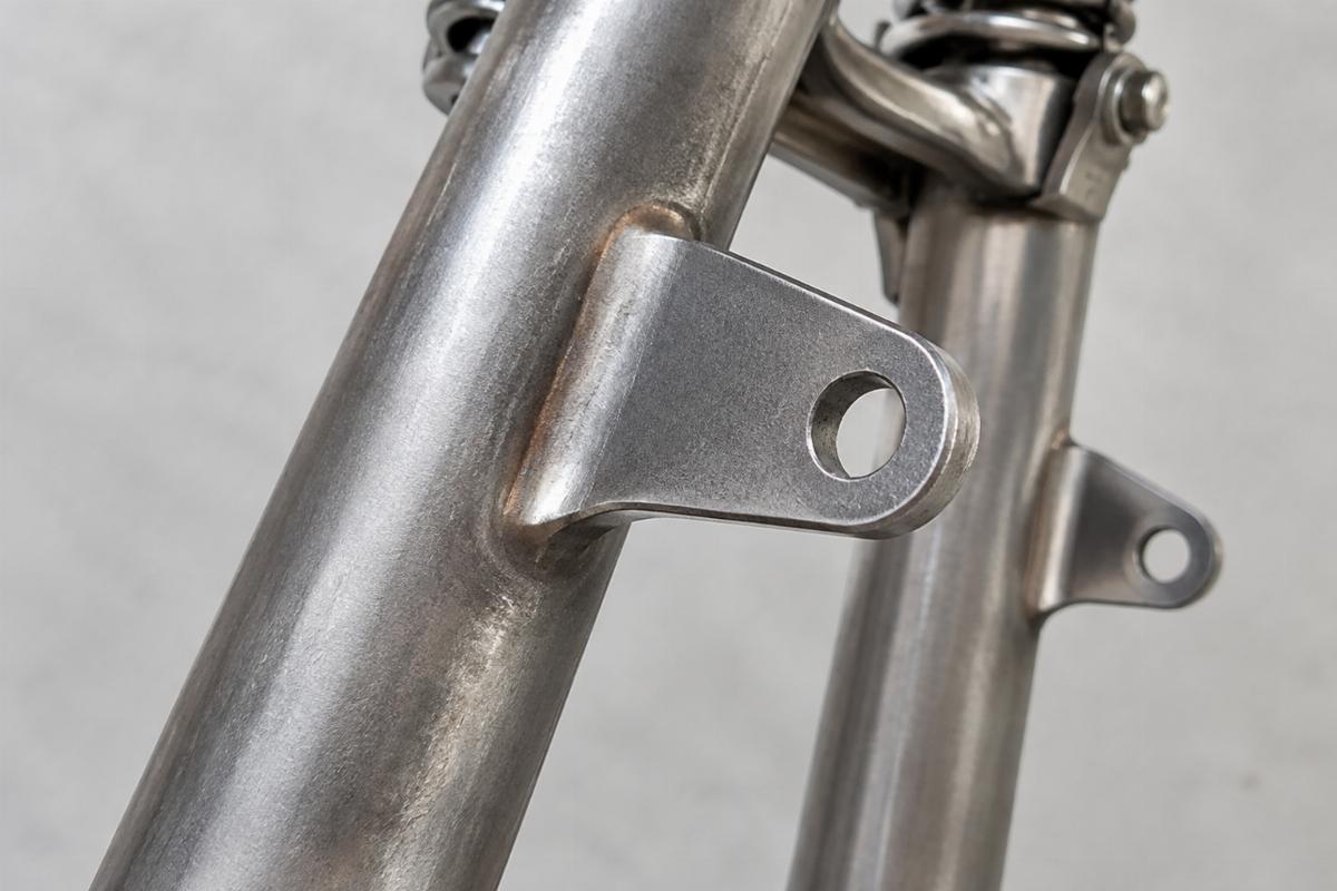 Detail of raw springer fork brake stay tab ready for welding