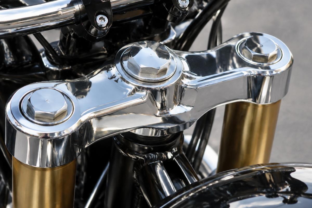 Detailed view of the chrome finish on the triple tree mounting points