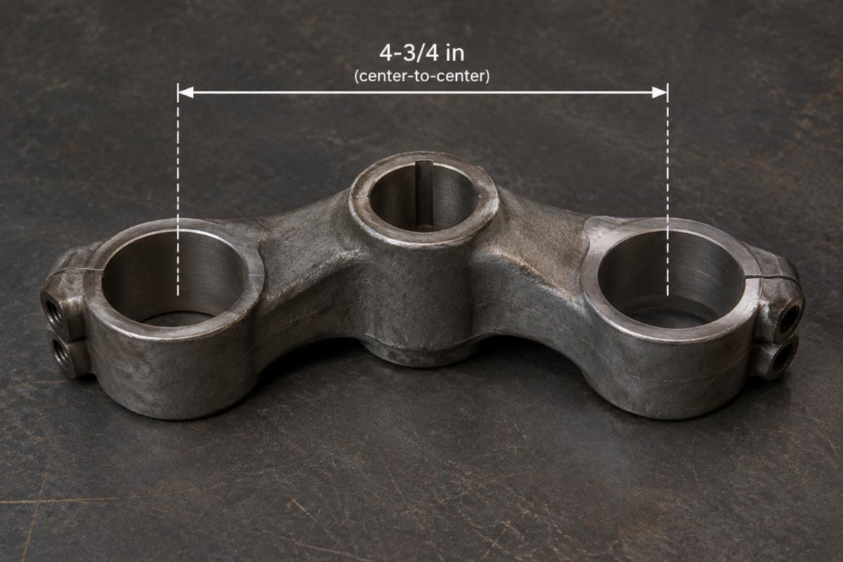 Raw spring fork offset triple tree forging showing 4-3/4 in center-to-center distance