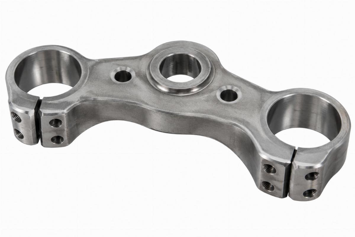 Raw spring fork top triple tree for springer front ends showing machined fork fitting holes
