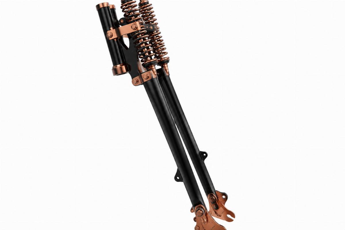 Side profile view of the 22 inch springer fork assembly for softail in black and copper finish