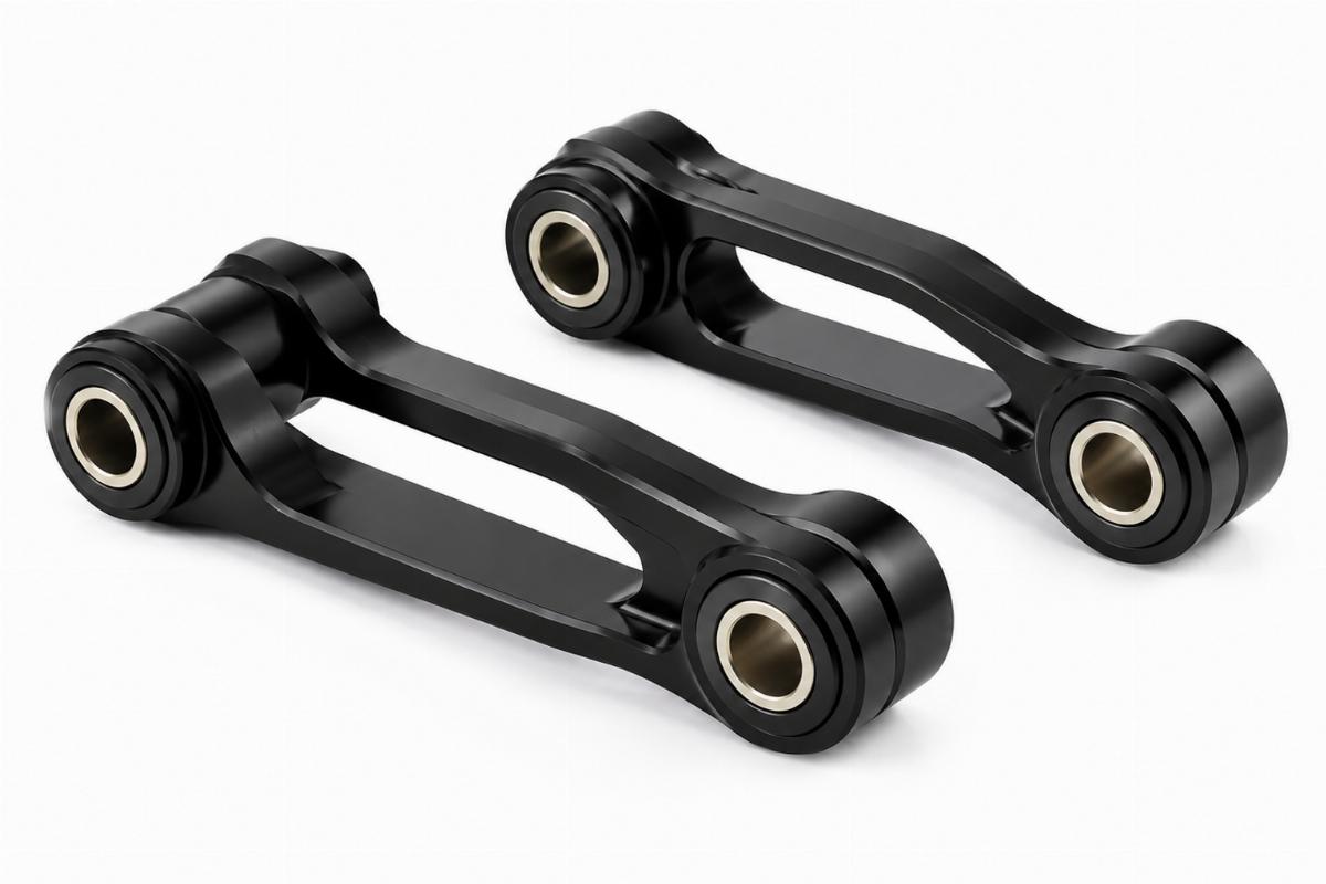 Spring fork rocker kit in black finish showing pre-installed bushings