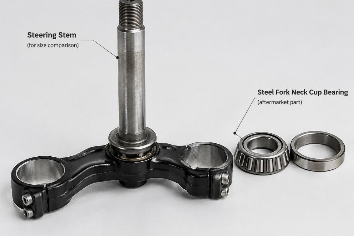 Steel fork neck cup bearing motorcycle aftermarket part placed next to a steering stem for size comparison